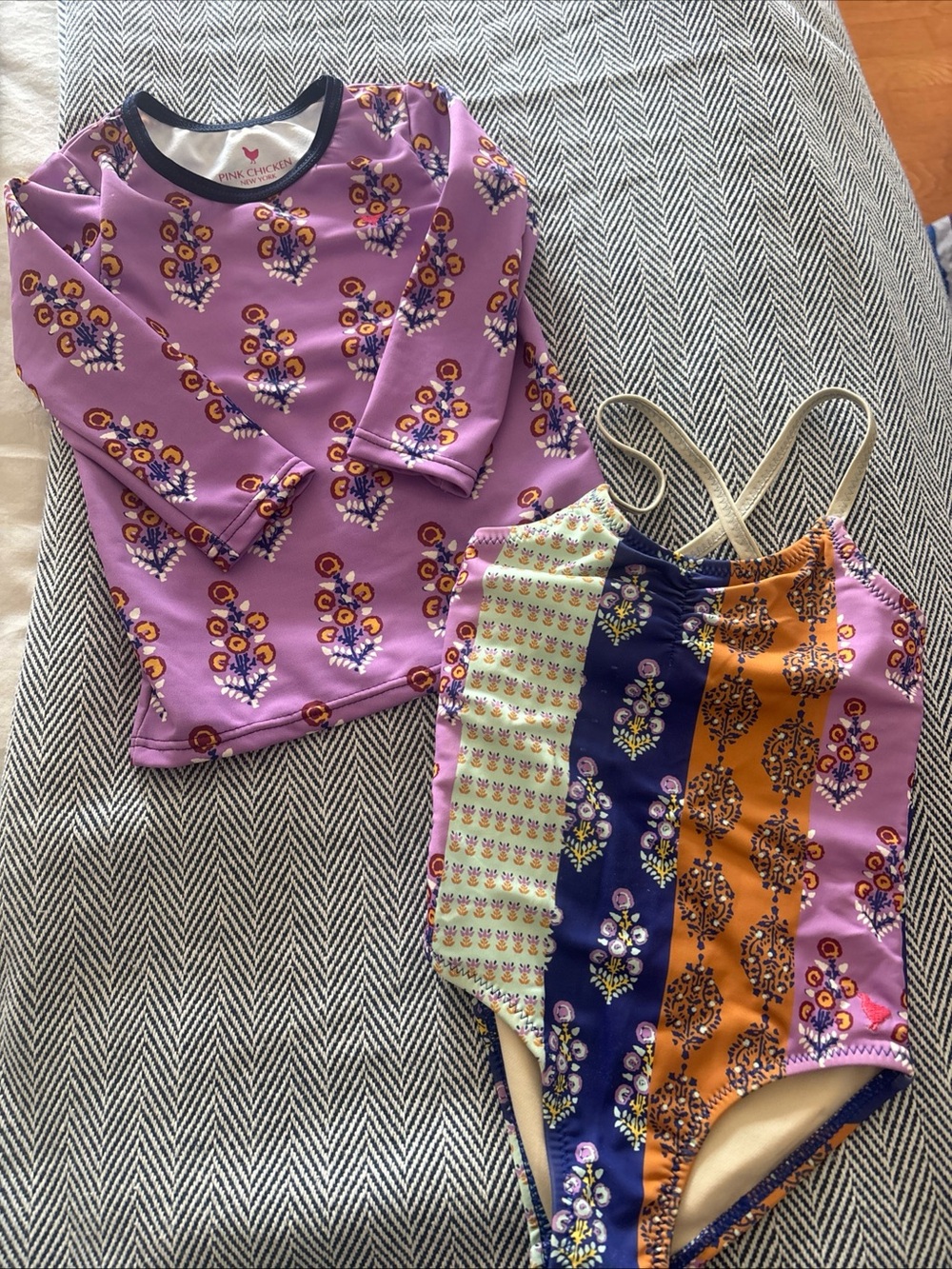 Pink Chicken Purple Floral Rash Guard and Multicolor One-Piece Swimsuit